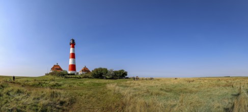 Panoramic photo 40 metre high Westerheversand lighthouse built in 1906 on the Eiderstedt peninsula