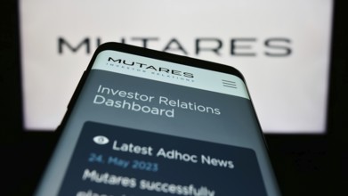 Stuttgart, Germany, 06-24-2023: Mobile phone with webpage of German investment company Mutares SE