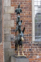 The famous bronze statue of the Bremen Town Musicians with the figures of a donkey, dog, cat and