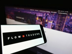 Stuttgart, Germany, 02-13-2022: Mobile phone with logo of Dutch financial company Flow Traders N.V.