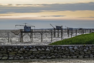 Sunset over Fishing huts over Randonnee entre Histoire et Nature, Fouras, Fouras-les-Bains,