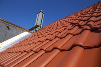 Close-up of a tiled roof that has just been tiled over