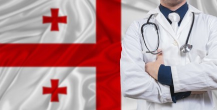 Male doctor with stethoscope on Georgia flag. Doctor holding stethoscope on Georgia flag