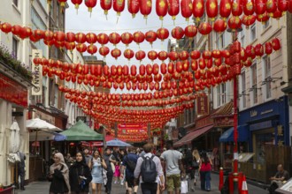Red Chinese lanterns crossing above Gerrard Street, Chinatown, West End, London, England, UK
