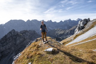 Mountain panorama with picturesque mountain landscape, mountaineers descending from the Gamsjoch,