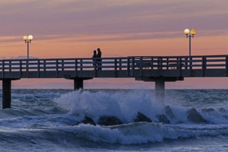 Sunset, pier, people, silhouettes, waves, swell, spray, street lamps, Wustrow, Fischland,