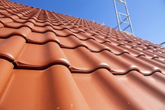 Close-up of a tiled roof that has just been tiled over