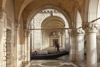 Doge's Palace, arcades on the south side, gondola on the Rio di Palazzo o dell Paglia, Venice,