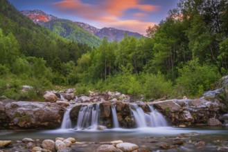 View of a waterfall of the Rio Plima stream in the evening light, long exposure, landscape photo,