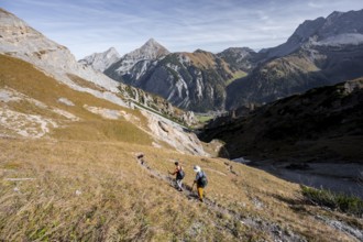 Mountain panorama with picturesque mountain landscape, mountaineers descending from the Gamsjoch,