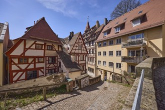 Historic half-timbered houses, residential buildings, gables, pointed roofs, sandstone wall, metal