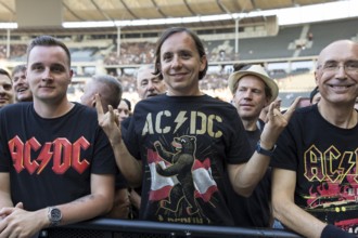 Fan in the front row with AC/DC Berlin shirt in front of the concert of AC/DC live on Power Up Tour