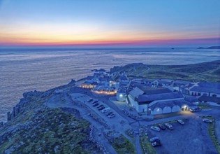 Land's End, landscape and hotel on the Atlantic, at dusk. Land's End, the tip of the headland in