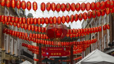 Red Chinese lanterns crossing above Gerrard Street, Chinatown, West End, London, England, UK