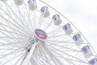 Mighty Ferris wheel with gondolas in front of a bright sky, Ferris wheel construction, Calw,