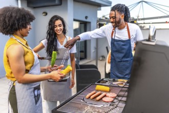 Chefs grilling delicious meats, sausages, corn, and peppers for a lively barbecue party on a