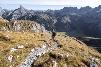 Mountain panorama with picturesque mountain landscape, mountaineers descending from the Gamsjoch,