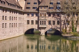 Heilig-Geist-Spital, historical hospital, river Pegnitz, tree, reflection, water surface,