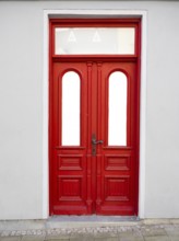 A red entrance door, Mecklenburg-Vorpommern, Germany