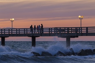 Sunset, pier, people, silhouettes, waves, swell, spray, street lamps, Wustrow, Fischland,