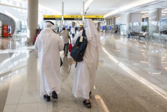 Airport Arab with traditional garment and headdress, Abu Dhabi, United Arab Emirates