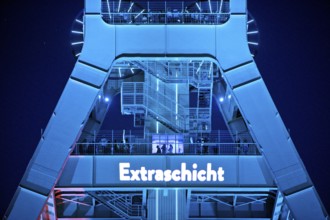 Illuminated headframe of the German Mining Museum with people, Extraschicht, Bochum, Ruhr area,