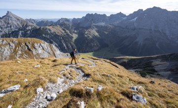 Mountain panorama with picturesque mountain landscape, mountaineers descending from the Gamsjoch,