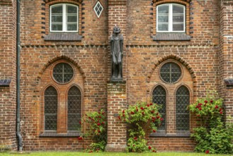 Sculpture The Beggar by Ernst Barlach in the inner courtyard of the cloister of Ratzeburg