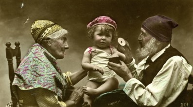 Grandma and grandpa with grandson, 1910, A baby is lovingly held by his grandparents, surrounded by