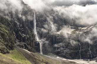 Waterfall in the cloudy Cirque de Gavarnie basin, UNESCO World Heritage Site in the Pyrenees