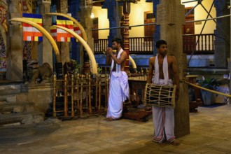 Temple of the sacred Tooth Relic or Sri Dalada Maligawa, Drummer and musician in front of the Holy