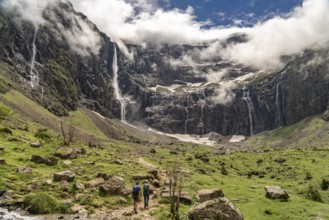 Hikers in the cloudy Cirque de Gavarnie basin, UNESCO World Heritage Site in the Pyrenees National