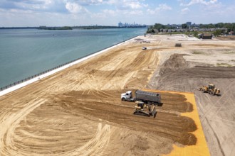 Detroit, Michigan - Workers spread clean dirt after old industrial contamination of cadmium,