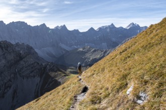 Mountain panorama with picturesque mountain landscape, mountaineers descending from the Gamsjoch,