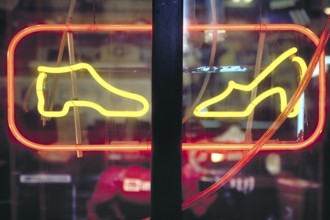Illuminated advertising in a shoe shop, Manhattan, New York City, USA