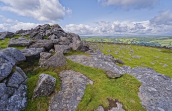 Stones and landscape at the top Tor tor rock hill in Dartmoor National Park. Widecombe-in-the-Moor,