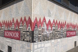 Painting on house wall with name, renovated Schnoor neighbourhood with small shops, galleries,