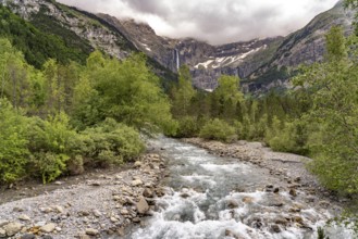 The Gave de Gavarnie river in the Cirque de Gavarnie basin, UNESCO World Heritage Site in the