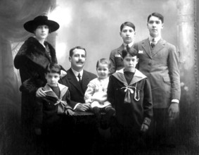Family with 5 children, portrait of a family in traditional dress, formal group photo, historical