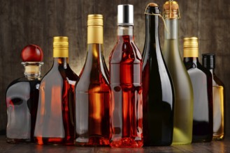 Composition with bottles of assorted alcoholic beverages