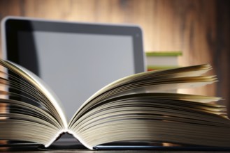 Composition with books and tablet computer