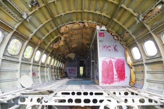 The interior of a derelict, vandalised aircraft in Bangkok, Thailand
