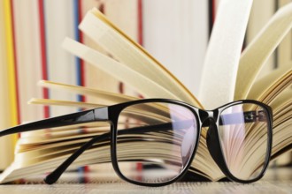 Composition with glasses and books on the table