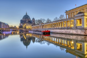 The Berlin Cathedral on Museum Island and the Spree in front of sunrise