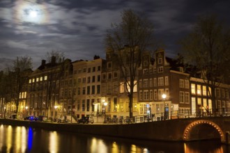 Full moon over the Herengracht in Amsterdam, Netherlands in springtime