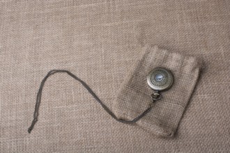 Mechanical pocket watch on a sack