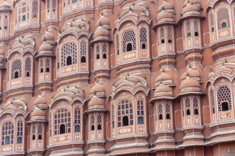Jaipur, India, December 11, 2019: Beautiful windows of the Hawa Mahal, Palace of Winds in the pink