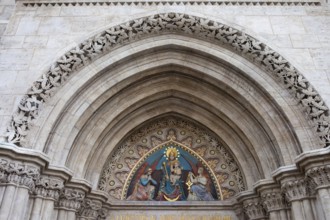 19th century bas-relief of the Madonna with Child between two angels on the Matthias Church