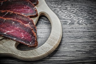 Sliced steak wooden chopping board food concept