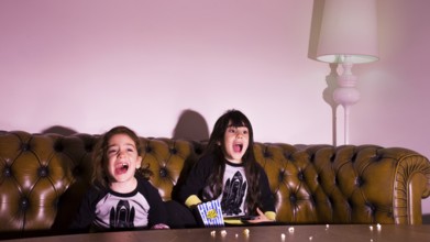 Scared kids watching movie home